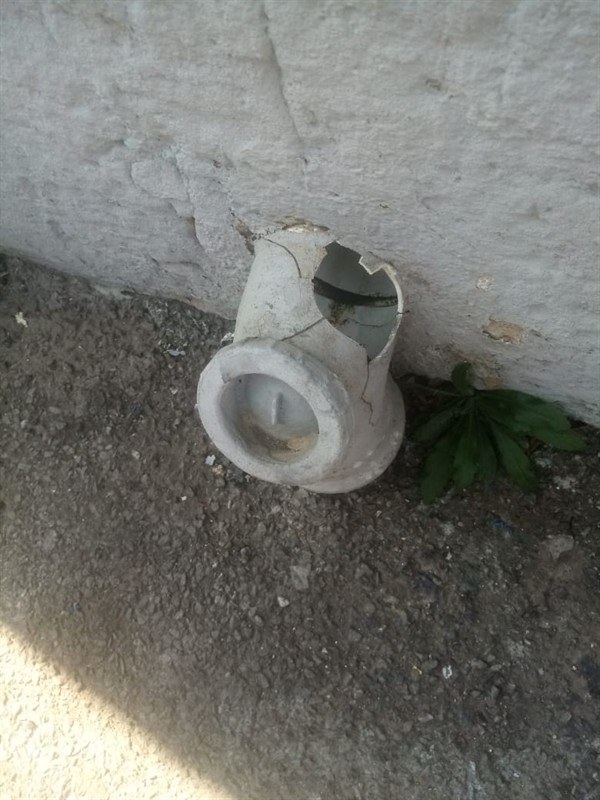 Sewer line repairs image showing a damaged broken drain or sewer fitting at ground level during plumbing inspection by Plumb A Nator.